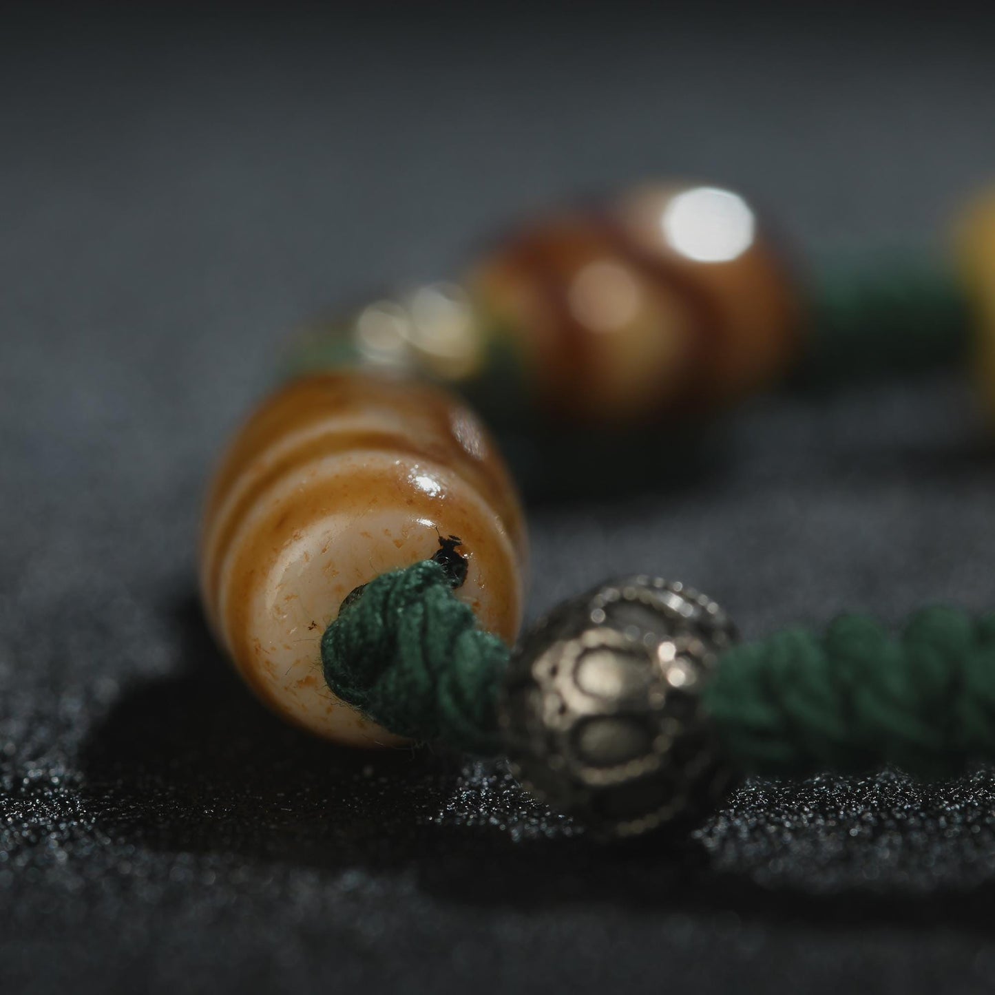 Antique 2-Eye Dzi Bead Bracelet: Handwoven Tibetan Amulet